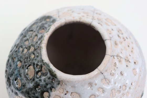 Raku and black smoked vessel.
