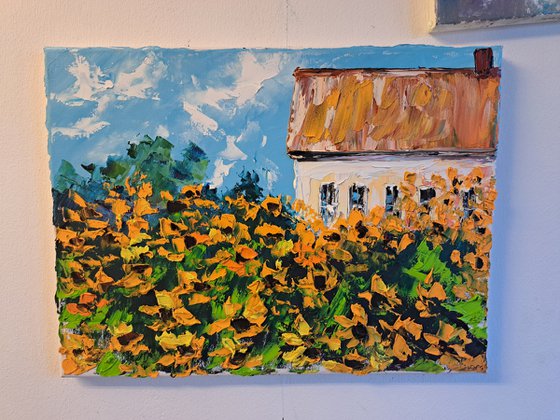 House and yellow flowers