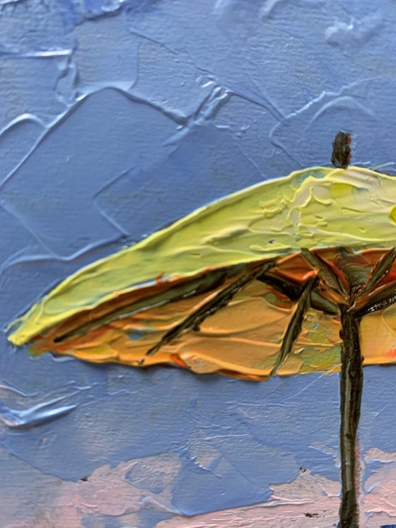 Yellow parasol on the Beach.