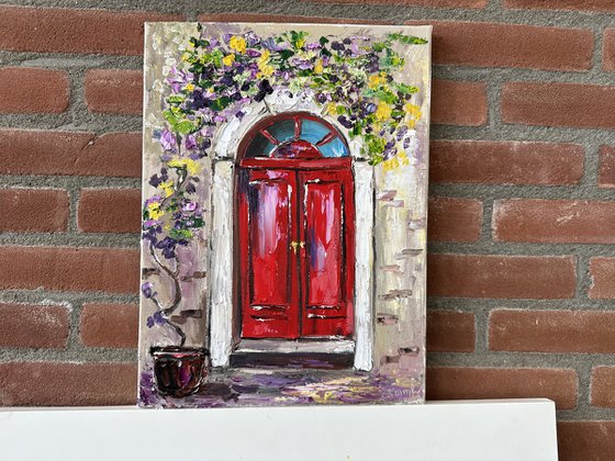 Red door with flowers