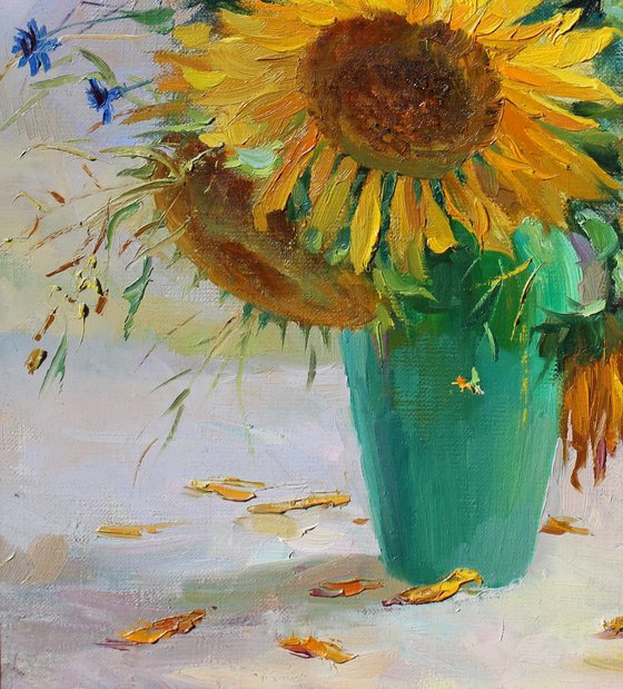 Sunflowers in a green vase