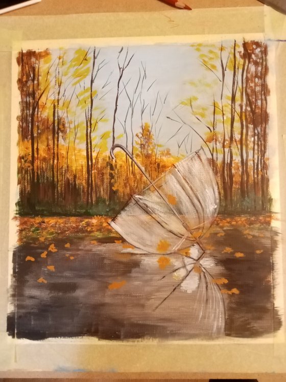 A forgotten umbrella in autumn