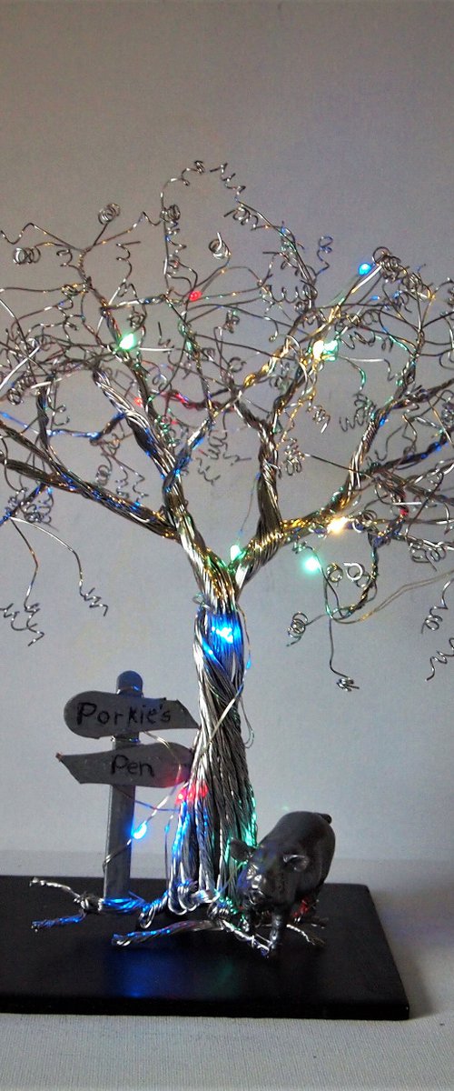 Tree with pig, signpost and lights by Steph Morgan
