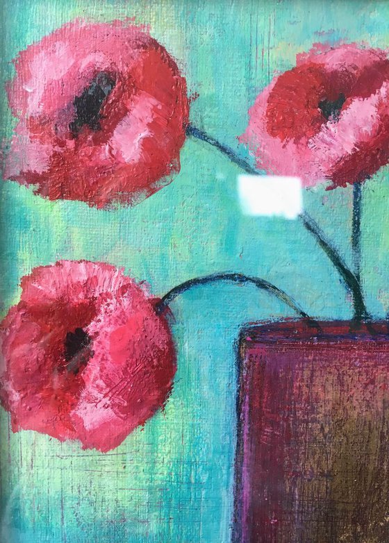 Poppies in gold vase