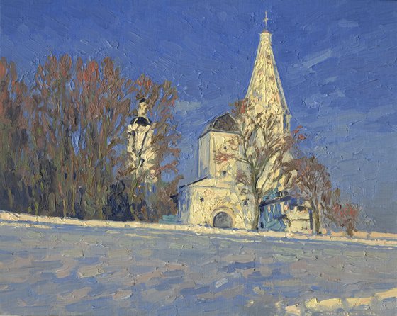 Frosty evening. View of the water tower and the Church of the Ascension