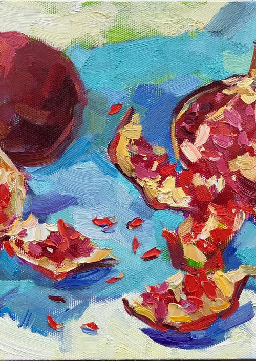 pomegranate on blue by Yuliia Pastukhova