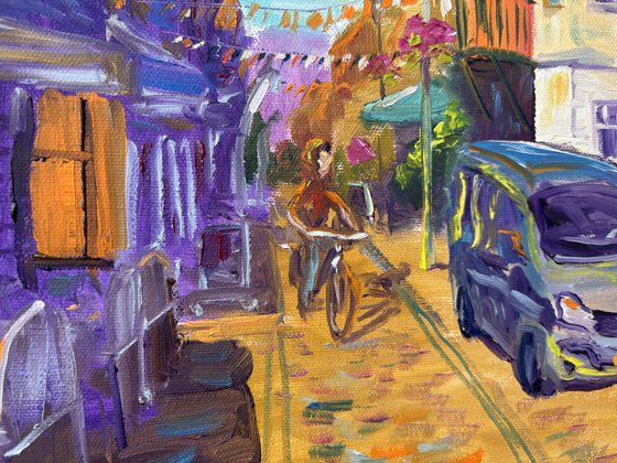 Festive Dutch town scene with cyclist