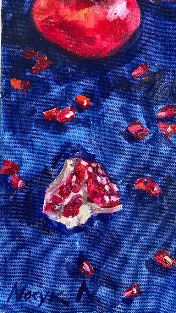 Pomegranates on blue
