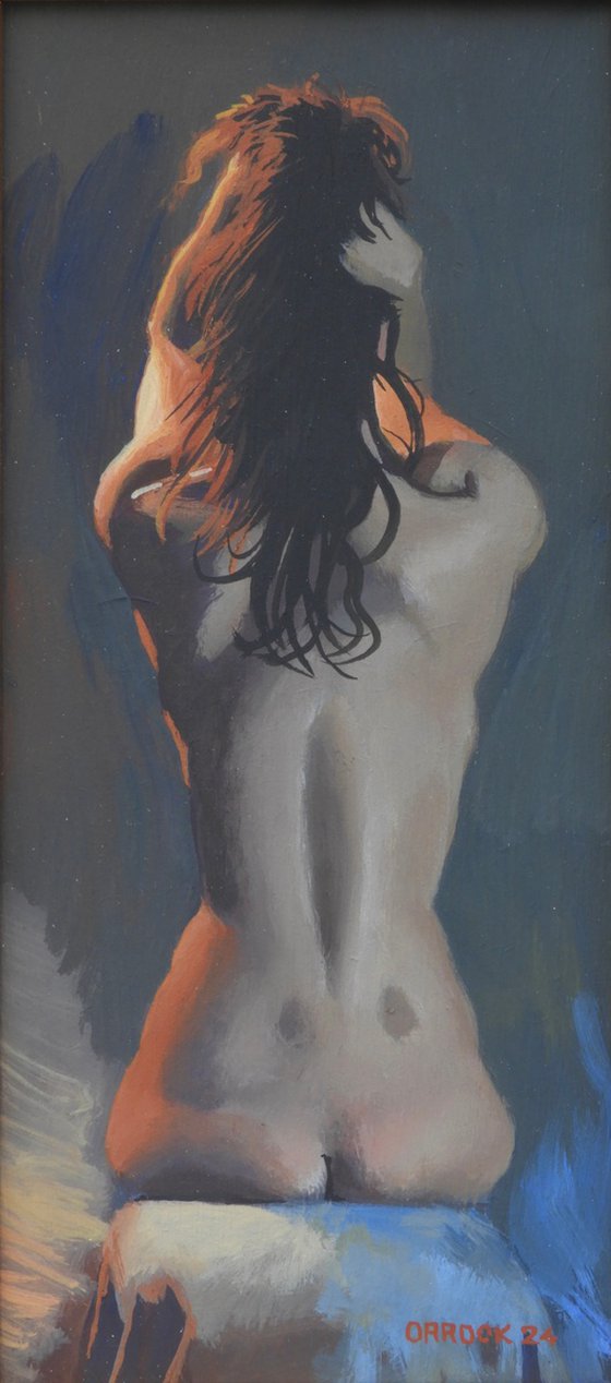 Nude seated back view