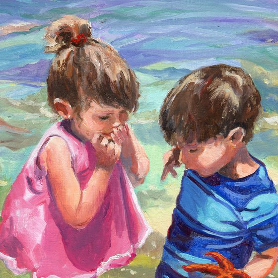 Children with starfish on the beach