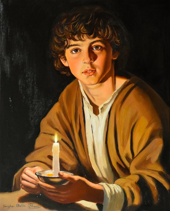 A boy with a candle