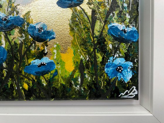 Blue poppies on gold leaf