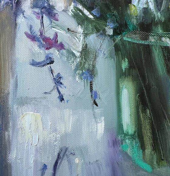 Blue wildflowers on window