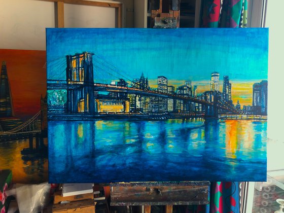 Brooklyn Bridge to Manhattan sunset with blue