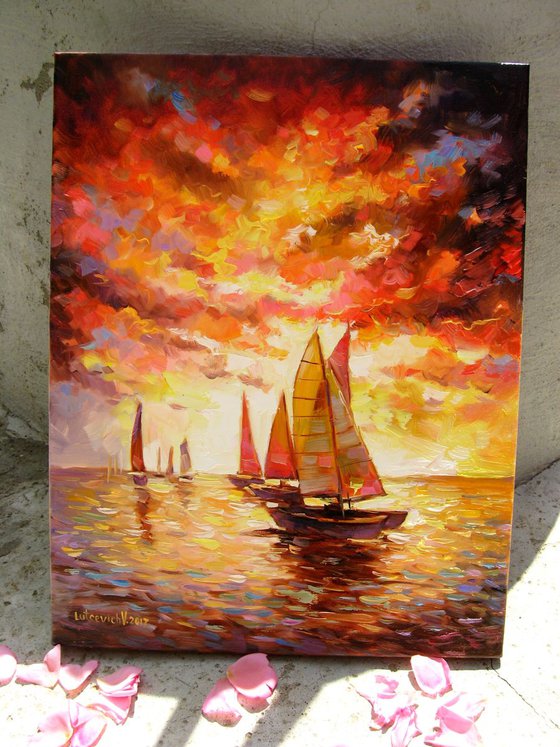 Sailboats on the sea. Flaming evening