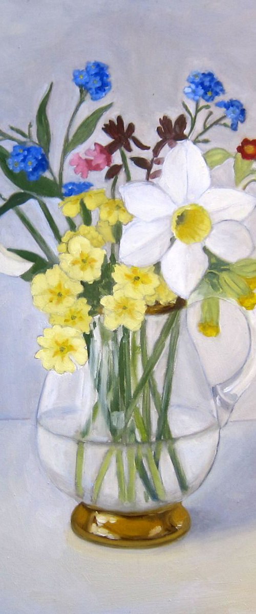 Spring flowers in glass jug by Sophie Colmer-Stocker