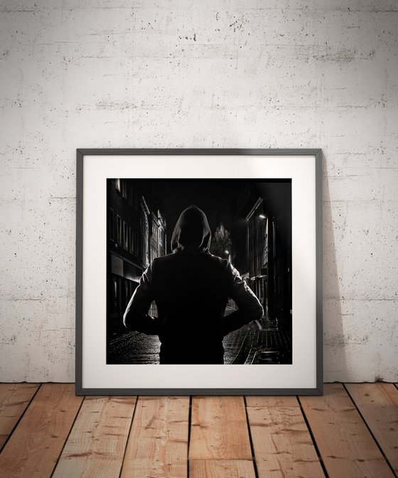 Night Silhouette #1/10. Limited Edition 12x12 inch Print of a Man wearing a hoodie in the street.