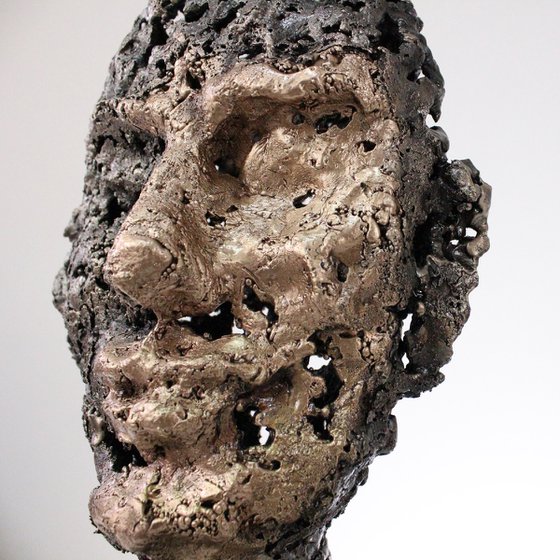 A rock - Face sculpture bronze steel