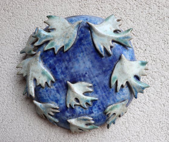 Ceramic birds on a round base