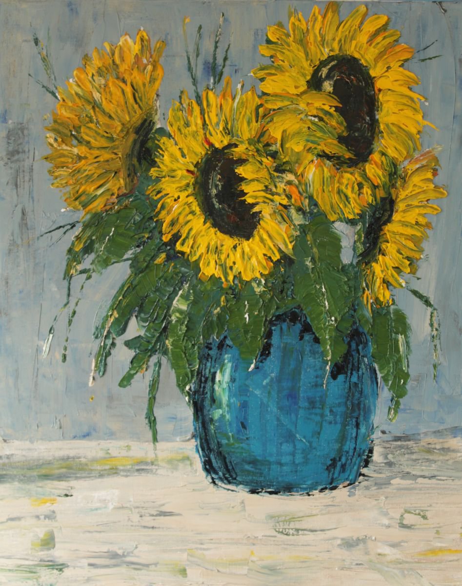 Sunflowers in blue pot. by John Halliday