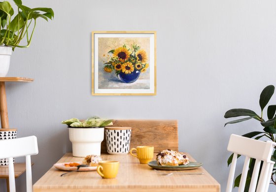 Sunflowers bouquet in a blue glass vase still life