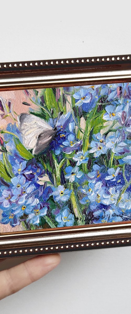 Forget-me-not flowers with butterfly by Nataly Derevyanko