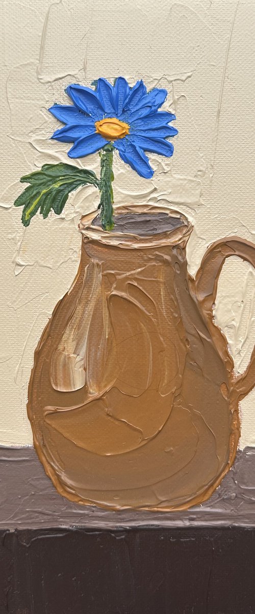 Blue flower in a jug by Guzaliya Xavier