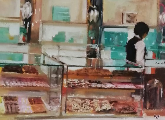 Behind the cake counter