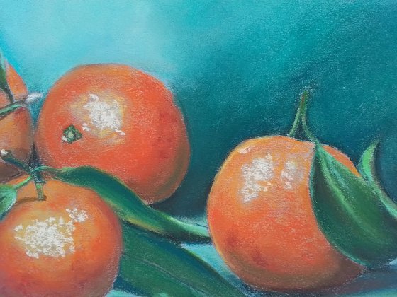 Golden-red tangerines on a turquoise background