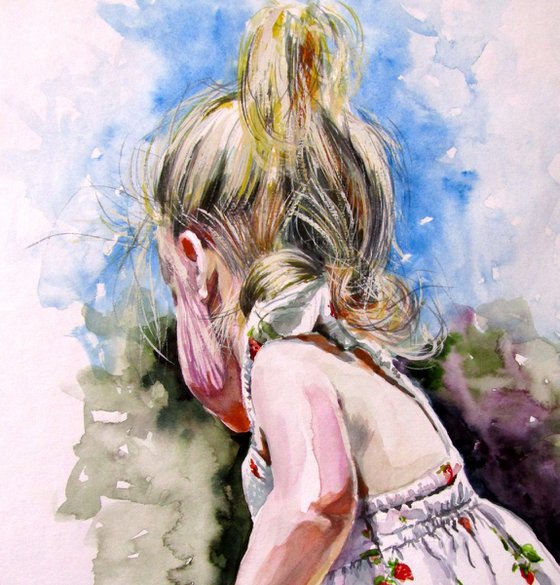 Little girl picking flowers