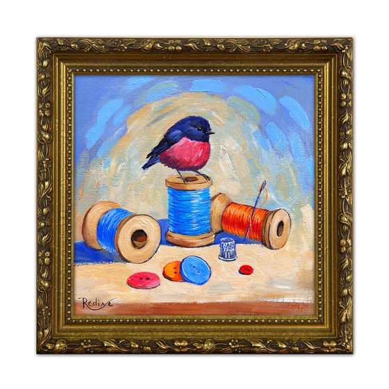 Pink Robin bird and thread spools