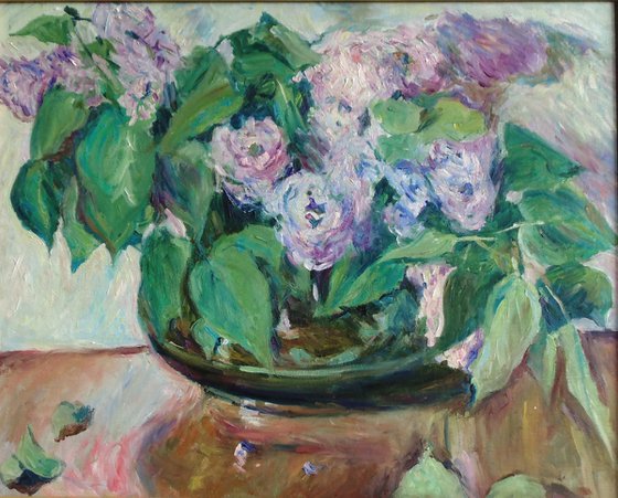 Lilacs in a pot-bellied vase.