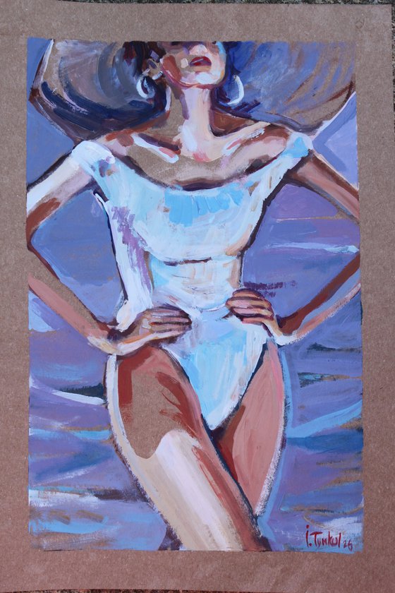 Girl on the beach in a retro swimsuit