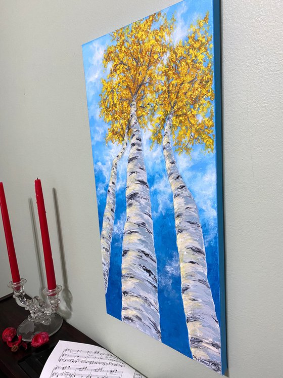 Yellow birches in the clouds