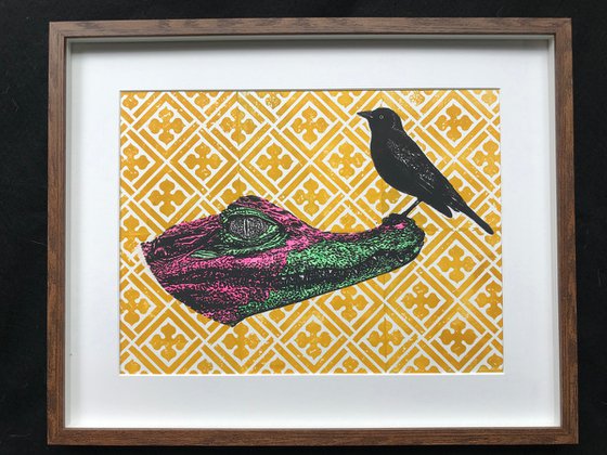 Colourful Alligator and black bird