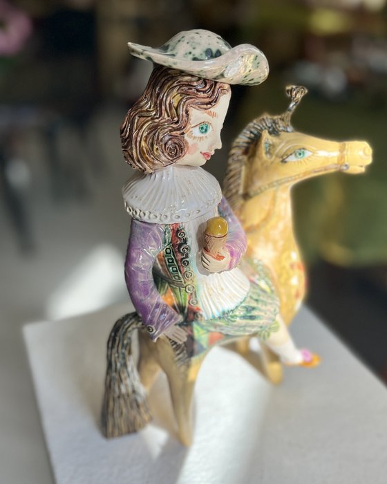 Vintage dressed girl with ice riding horse.