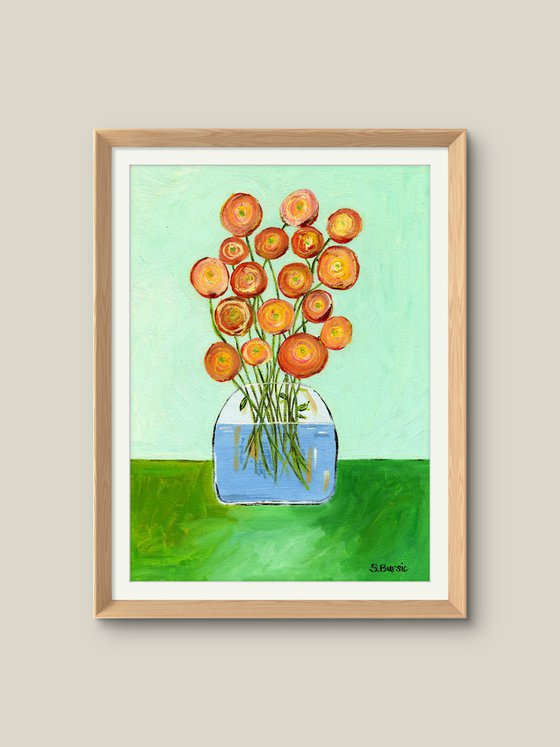 Vase with red orange flowers