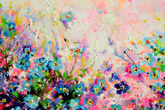 Forget me not flower field at sunrise