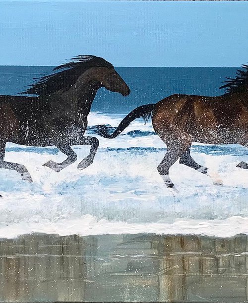 Splashing by the ocean by Jackie Ward