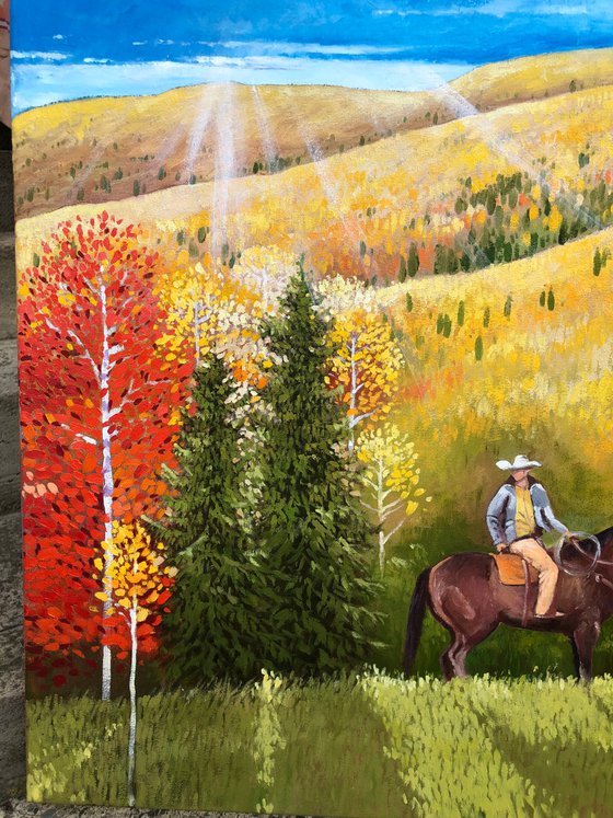 Cowboy in autumn forest