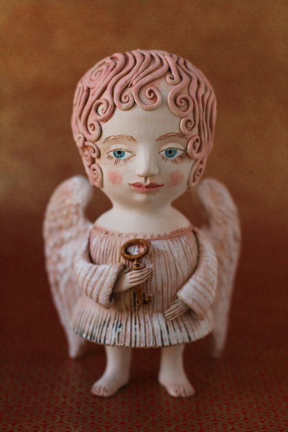 Angel holding a key. Ceramic OOAK sculpture by Elya Yalonetski