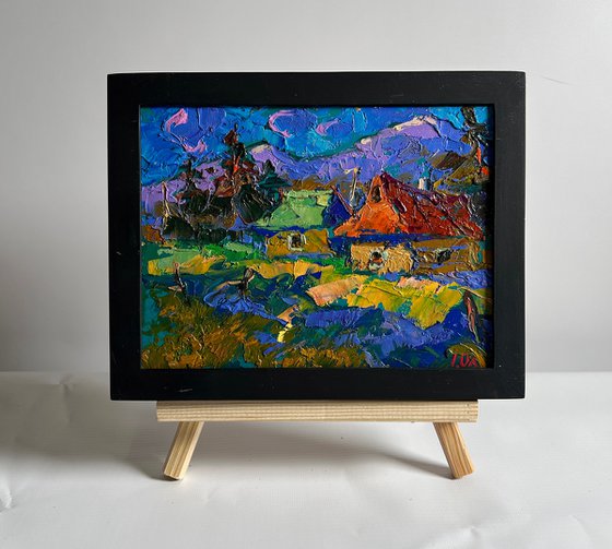 Village and blue mountains