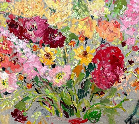 Summer day. Flowers in a red jug.