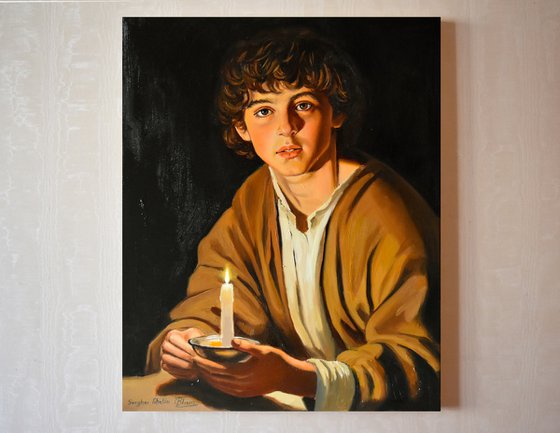 A boy with a candle