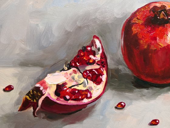 Ripe pomegranate with seeds still life 2