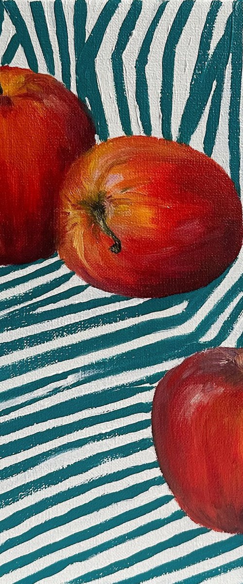 Red apples on green by Irina Sherbiak