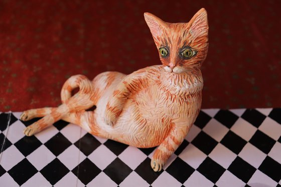 Red Fury Resting. Ceramic cat sculpture.