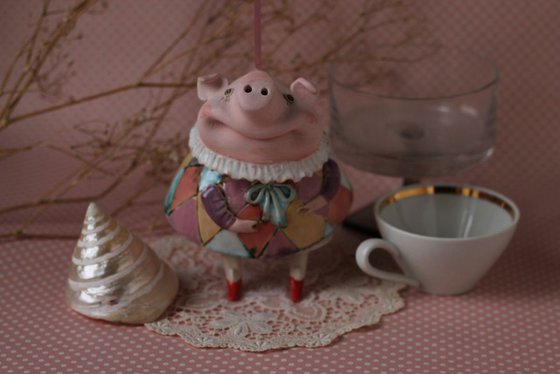 Little piggy in harlequin dress. Hanging sculpture, bell doll by Elya Yalonetski