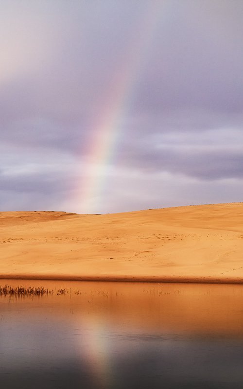 A rainbow over the dune by Karim Carella
