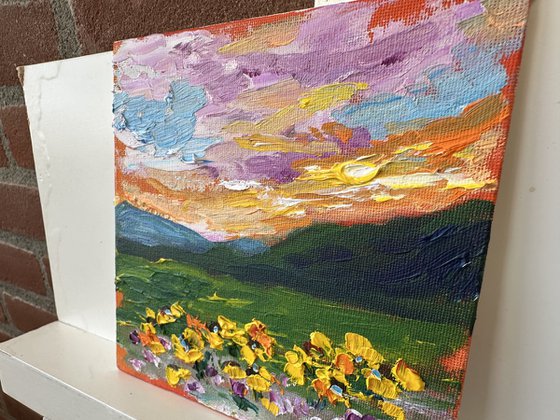 Orange sunset with flowers